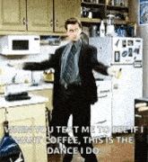 a man in a suit and tie dancing in a kitchen