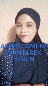 a woman wearing a head scarf and a polka dot shirt has alsya comment mantabek keren written in blue