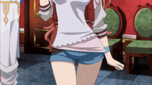 a girl in a white shirt and blue shorts is standing in a room