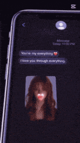 a phone displays a message that says i love you through everywhere