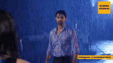 a man and woman are standing in the rain looking at each other .