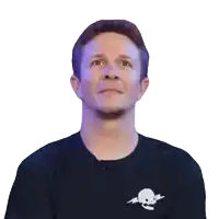 a man wearing a black shirt with a skull on it