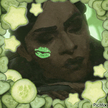 a picture of a woman with a green kiss on her face
