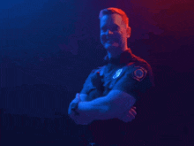 a police officer is standing with his arms crossed and a patch on his chest that says police officer