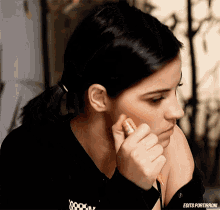 a close up of a woman 's face with the words edits portirroni on the bottom right