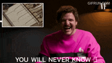a man in a pink sweater is laughing with the words you will never know below him