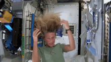 space astronaut hairwashing water