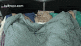 a couple of people laying in bed under a blanket with the website kulfyapp.com visible in the corner