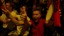 a man giving a thumbs up while wearing a shirt that says league of legends