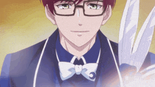 a man with glasses and a bow tie holds a pair of scissors