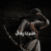 a painting of a man holding a sword with arabic writing