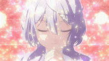 a girl with purple hair is praying with her eyes closed in front of a pink background
