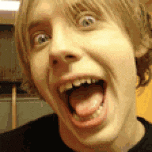 a close up of a man with his mouth open