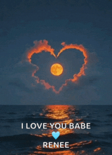 a picture of a full moon with a heart shaped cloud