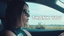 a woman wearing sunglasses is driving a car with the words thank you written on the bottom