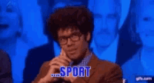 a man in a suit and tie with the word sport written on his face