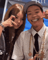 a man and a woman are posing for a picture with the number 6 on the bottom right