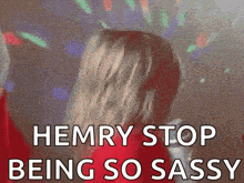a woman in a red dress is dancing in front of a disco ball with the words `` henry stop being so sassy '' .