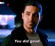 a man says " you did good " in front of a carnival