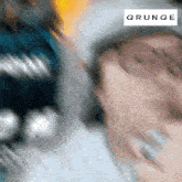 a blurred image of a person with the word grunge on the bottom