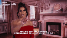 a woman in a red dress says you 're not my father