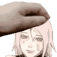 a close up of a person 's hand touching a girl 's face .