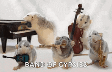 a group of mice are playing musical instruments and the words band of gypsies are above them