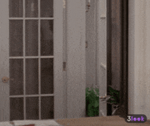 a blurred image of a door with the words 3look on the bottom right