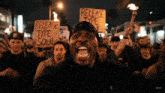 a group of protesters holding signs that say release type soul