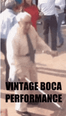 an elderly man with a cane is dancing in front of a crowd with the words vintage boca performance written below him