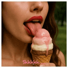 a woman is sticking her tongue out while eating an ice cream cone ..