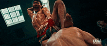 a poster for kahar shows two men fighting