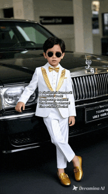 a young boy in a white suit is standing in front of a car