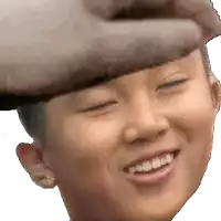 a close up of a person wearing a hat smiling