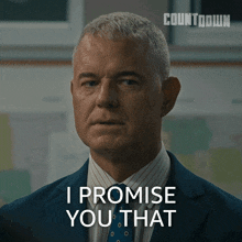 a man in a suit and tie is saying i promise you that