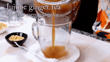 jujube ginger tea daechu saenggangcha emily kim maangchi pouring into the cup hot jujube ginger tea