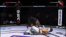 a video game screen shows a ufc match between tyson and pax