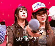 a girl wearing a hat that says green syndrome