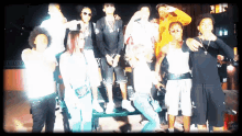 a group of people posing for a picture with one wearing a shirt that says ' gucci '