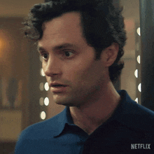 a close up of a man 's face with a netflix logo on the bottom