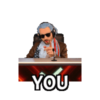 a man sitting at a desk with a microphone and the words youngest