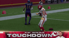 a football player named travis kelce is on the field during a touchdown