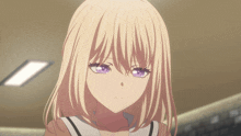 a girl with blonde hair and purple eyes looks serious