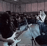 a person playing a guitar in front of a microphone with the words " hirjunfor_official " on the bottom