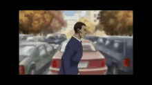 a man in a suit is walking in front of a red car