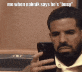 a man with a beard is taking a selfie with the caption " me when naknik says he 's "