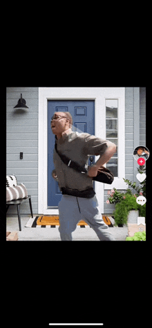 a man is running in front of a blue door while holding a briefcase .