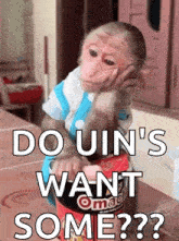 a monkey sitting at a table with a bag of omaha chips