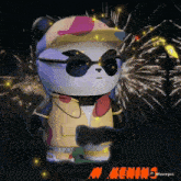 a panda wearing sunglasses and a hat is standing in front of fireworks and the word kening is on the bottom