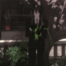 a man with horns is holding three red hearts in his hands .